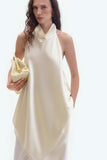 Кремова шовкова блузка з відкритою спиною