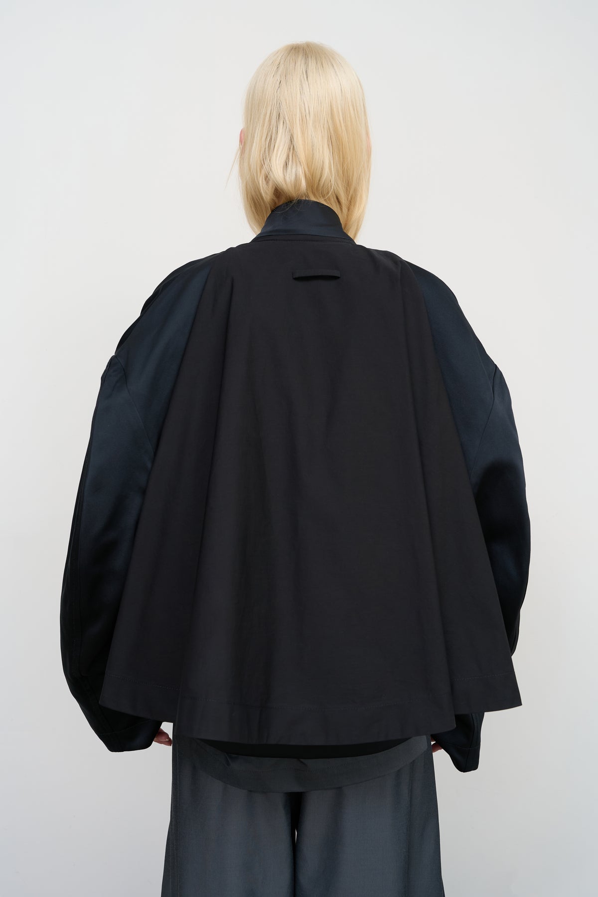 BLACK CAPE OVERLAY BOMBER JACKET